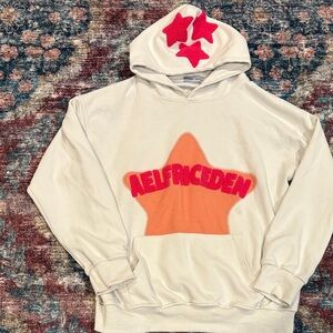 Aelfric Eden White Hoodie with Orange and Red Star Accents